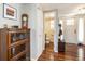 Entryway with hardwood floors, coat rack, and view of the bathroom at 11022 E Fair Cir, Englewood, CO 80111