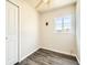 Simple bedroom with wood-look floors and ceiling fan at 7695 Kearney Dr, Commerce City, CO 80022