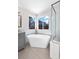 Luxurious bathroom with a free-standing tub and a separate shower at 8782 Troon Village Pl, Lone Tree, CO 80124