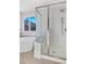 Bathroom with a walk-in shower and a built-in bench at 8782 Troon Village Pl, Lone Tree, CO 80124