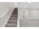 Basement staircase leading to finished basement area at 8782 Troon Village Pl, Lone Tree, CO 80124