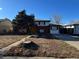 Brick ranch home with a yard and tree at 3073 Zion St, Aurora, CO 80011