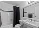 Clean bathroom with a tub, toilet, and updated vanity at 1223 S Wheeling Way, Aurora, CO 80012