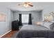 Spacious bedroom with hardwood floors, ceiling fan, and ample closet space at 1223 S Wheeling Way, Aurora, CO 80012