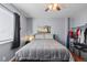 Bright bedroom with ceiling fan and closet at 1223 S Wheeling Way, Aurora, CO 80012