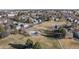Aerial view of community featuring green spaces and homes at 1223 S Wheeling Way, Aurora, CO 80012