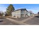 Exterior view of the townhome showing the side and rear of the property with landscaping at 1223 S Wheeling Way, Aurora, CO 80012