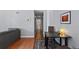 Hallway with hardwood floors and access to other rooms at 1223 S Wheeling Way, Aurora, CO 80012