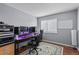 Home office with a desk, chair, and ample lighting at 1223 S Wheeling Way, Aurora, CO 80012