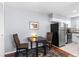 Bright kitchen with stainless steel appliances and breakfast nook at 1223 S Wheeling Way, Aurora, CO 80012