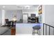 Modern kitchen with stainless steel appliances and breakfast bar at 1223 S Wheeling Way, Aurora, CO 80012