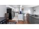 Modern kitchen with stainless steel appliances and granite countertops at 1223 S Wheeling Way, Aurora, CO 80012