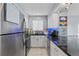 Modern kitchen with stainless steel appliances and granite countertops at 1223 S Wheeling Way, Aurora, CO 80012