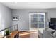 Bright living area with hardwood floors and sliding glass door to deck at 1223 S Wheeling Way, Aurora, CO 80012