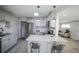 Updated kitchen with white cabinets, granite counters, and stainless steel appliances at 1341 W 68Th Ave, Denver, CO 80221