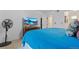 Bedroom with a queen bed, TV, and access to bathroom at 5765 W Atlantic Pl # 104, Lakewood, CO 80227