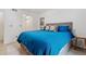Bedroom with a queen bed, access to hallway and vintage decor at 5765 W Atlantic Pl # 104, Lakewood, CO 80227
