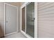 Private patio with sliding glass door access and exterior storage at 5765 W Atlantic Pl # 104, Lakewood, CO 80227