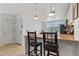 Kitchen features an island with seating and modern appliances at 5765 W Atlantic Pl # 104, Lakewood, CO 80227