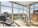 Modern condo dining area with glass table and city views at 1700 Bassett St # 1008, Denver, CO 80202