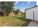 Large backyard with grassy area and mature trees at 7886 Cyd Dr, Denver, CO 80221