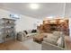 Finished basement features a brick fireplace and ample space for recreation at 7886 Cyd Dr, Denver, CO 80221