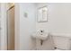 Basement bathroom with a sink, toilet, and shower at 7886 Cyd Dr, Denver, CO 80221