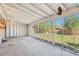 Spacious screened porch overlooking a grassy backyard at 7886 Cyd Dr, Denver, CO 80221