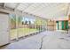 Spacious screened porch overlooks backyard, offering ample outdoor space at 7886 Cyd Dr, Denver, CO 80221