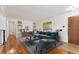 Living room with hardwood floors and staged furniture at 7886 Cyd Dr, Denver, CO 80221
