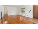 Living room featuring hardwood floors and large window at 7886 Cyd Dr, Denver, CO 80221