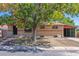 Brick ranch home with carport and mature landscaping at 7886 Cyd Dr, Denver, CO 80221