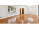 Bright living room with hardwood floors and large window at 7886 Cyd Dr, Denver, CO 80221