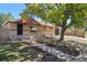 Ranch home with walkway and mature tree at 7886 Cyd Dr, Denver, CO 80221
