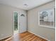 Bright entryway with hardwood floors and a door leading outside at 1250 S Monaco Pkwy # 2, Denver, CO 80224