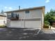 Two-car garage with attached balcony at 1250 S Monaco Pkwy # 2, Denver, CO 80224