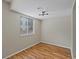 Simple bedroom with hardwood floors and a window with blinds at 1250 S Monaco Pkwy # 2, Denver, CO 80224