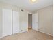 Spacious bedroom with double door closet and carpet at 1250 S Monaco Pkwy # 2, Denver, CO 80224