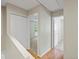 Upstairs hallway with access to bedrooms and closets at 1250 S Monaco Pkwy # 2, Denver, CO 80224