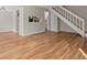 Spacious living room with hardwood floors and a view of the kitchen at 1250 S Monaco Pkwy # 2, Denver, CO 80224