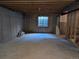 Unfinished basement with concrete floors and a window at 3893 Mallard St, Highlands Ranch, CO 80126