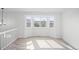 Bright dining room with bay window and wood-look flooring at 121 Tilbury Ave, Castle Rock, CO 80104