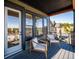 Relaxing deck with wooden chairs and views of the surrounding area at 3907 Piney Grove St, Evergreen, CO 80439