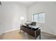 Bright home office features a large desk, window, and carpet at 3907 Piney Grove St, Evergreen, CO 80439