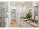 Spa-like bathroom with double sinks and marble shower at 3907 Piney Grove St, Evergreen, CO 80439