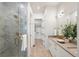 Luxurious bathroom with double vanity and walk-in shower at 3907 Piney Grove St, Evergreen, CO 80439