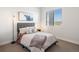 Bright bedroom with comfortable bed and large window at 3907 Piney Grove St, Evergreen, CO 80439