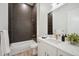 Modern bathroom with dark geometric tile and quartz countertop at 3907 Piney Grove St, Evergreen, CO 80439