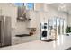 Modern kitchen with stainless steel appliances and white cabinets at 3907 Piney Grove St, Evergreen, CO 80439