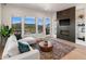 Bright living room with mountain views, fireplace, and comfortable seating at 3907 Piney Grove St, Evergreen, CO 80439